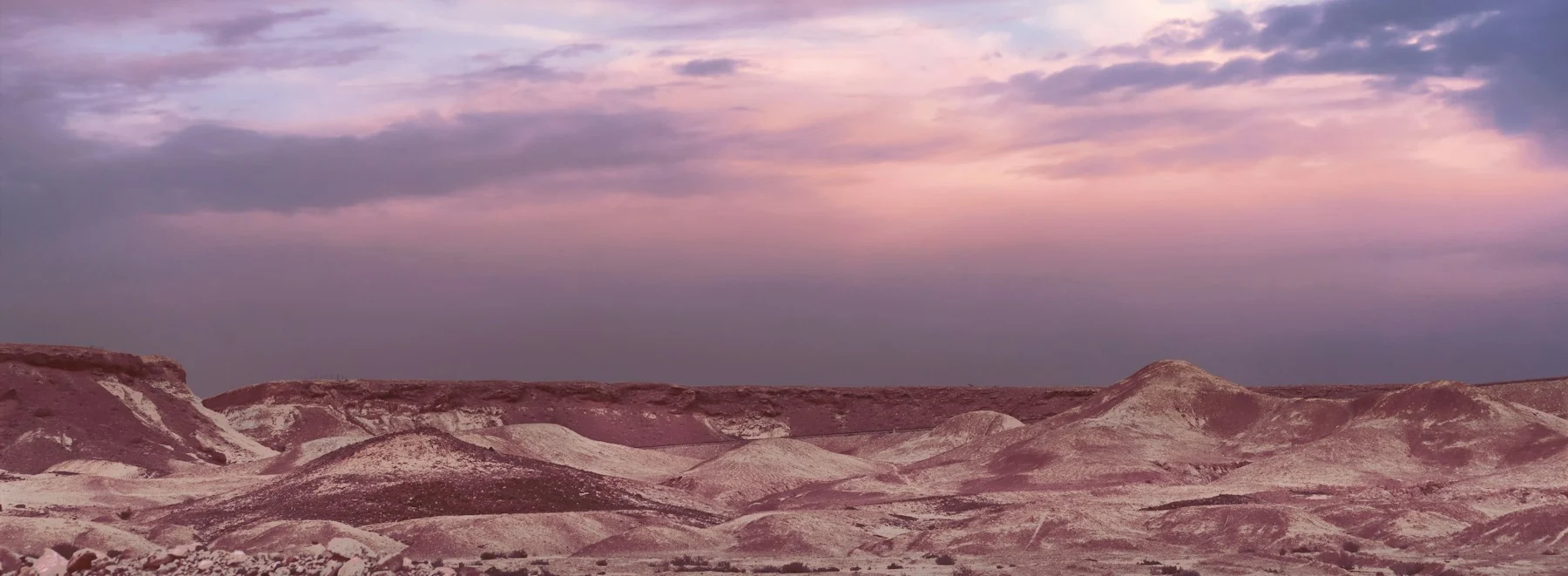 Layered desert mountains and valleys in Israel’s Negev at sunset