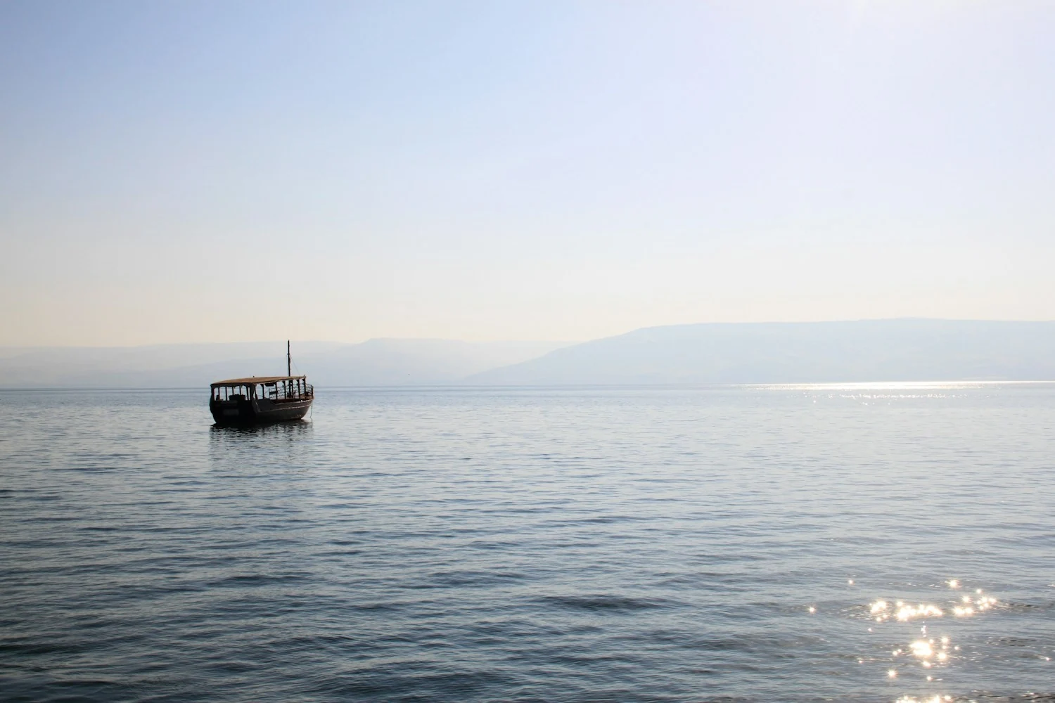 A wooden boat on the peaceful waters of the Sea of Galilee